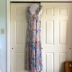 Large floral dress with open back and bow.